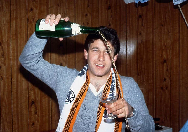 Ralph Milne pouring champagne from bottle January 1989