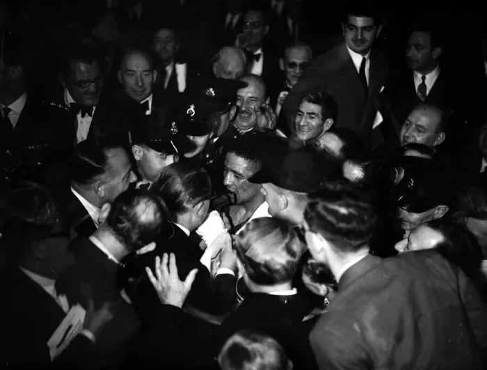 Framed Print : Randolph Turpin makes his way to the dressing room through the crowds after his fight