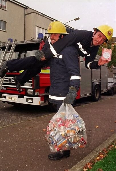 Rangers football player Ally McCoist as a fireman with a smoke alarm in one hand getting