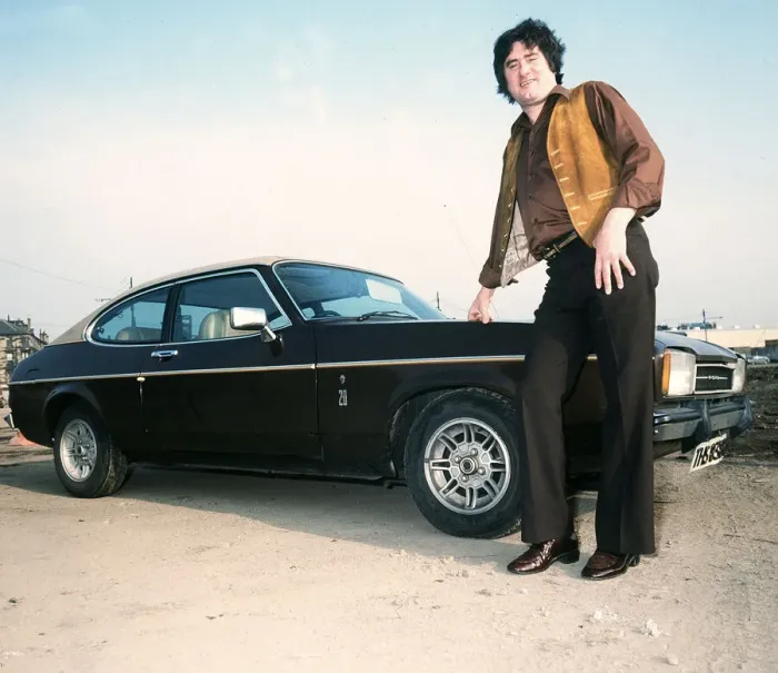 Framed Print : Former Rangers football player Jim Baxter poses besides his Ford Capri, circa 1980