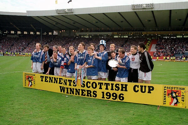 Rangers football team line up with their trophy after beating Hearts in the Tennents