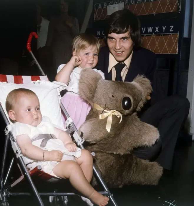 Framed Print : Rangers and Scotland footballer Tom Forsyth at the airport with his two daughters