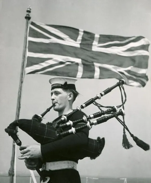 Framed Print : A rating aboard the Royal Navy aircraft carrier HMS Illustrious practising the bagpipes Framed Print : A rating aboard the Royal Navy aircraft carrier HMS Illustrious practising the bagpipes
