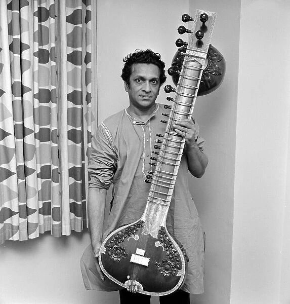Ravi Shankar seen here holding his sitar June 1966