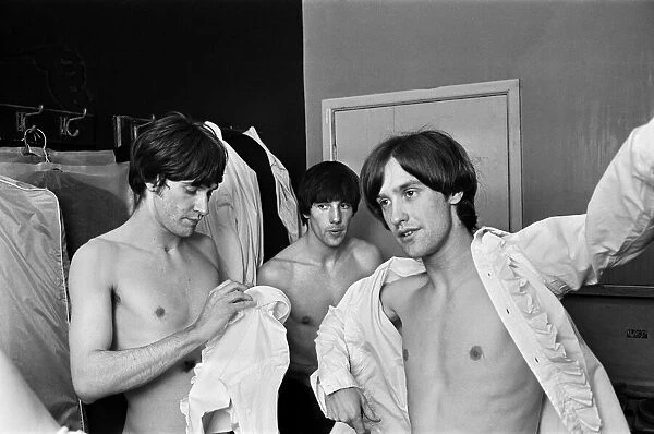 Ray Davies and Dave Davies of The Kinks pop group in their dressing room before a