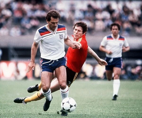 Ray Wilkins Football player playing for England in an International match running with