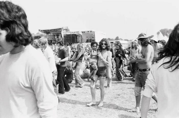 Framed Print : Reading Pop Festival. Festival goers walking around near the main stage