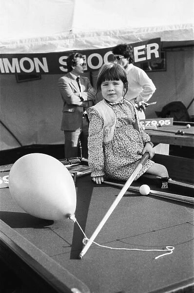 Reading show in Reading, Berkshire. (Picture) Young girl on pool table posing for