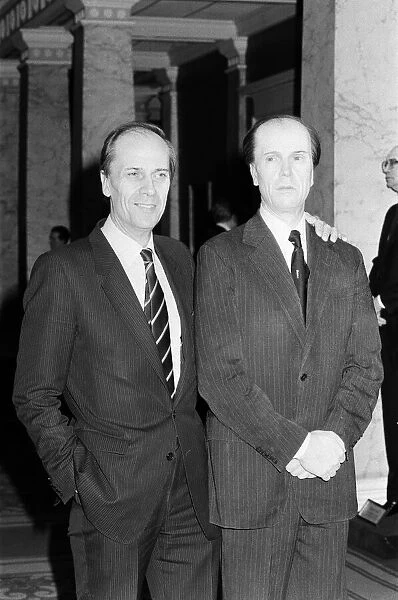 The real Norman Tebbit stands with a wax work of himself at a preview of his wax portrait