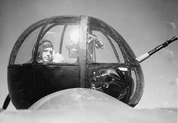 A rear gunner of the United States Army Air Force pictured in a Lockheed Hudson light