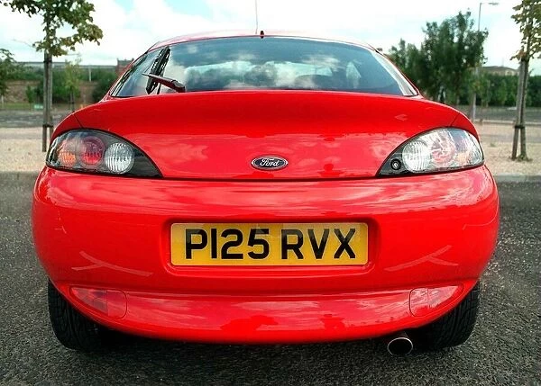 BACK REAR OF A RED FORD PUMA CAR REGISTRATION NUMBER P125 RVX AUGUST 1997