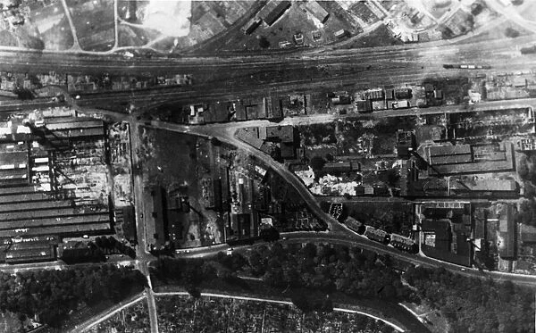 A reconnaissance photograph shows heavy damage in Karlsruhe after an R. A. F