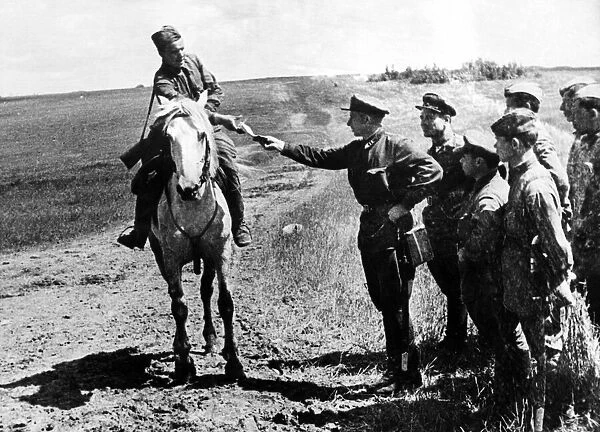Red Army dispatch rider on the Western Front. A Red Army man delivers a dispatch to his