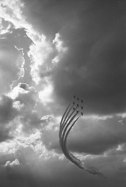 The Red Arrows in Diamond Nine formation seen here performing at RAF Scampton