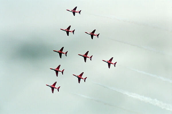The Red Arrows, RAF Aerobatic Team, performing at the 1993 500 CC British Motorcycle