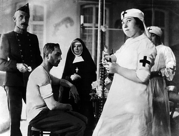 Red Cross nurses and doctors with wounded men during World War I Circa 1916