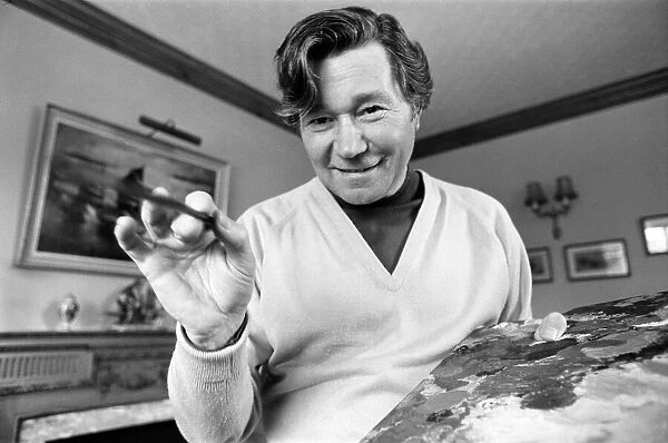 Reg Varney, actor and painter, touches up his latest work, at home in Enfield