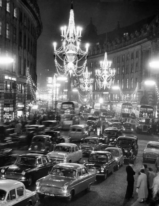 Framed Print : Regent Street packed with traffic as new Christmas lights in the form of chandeliers Framed Print : Regent Street packed with traffic as new Christmas lights in the form of chandeliers