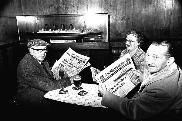 Three regulars at the Mauretania Pub in Wallsend, reading a copy of the Newcastle Journal