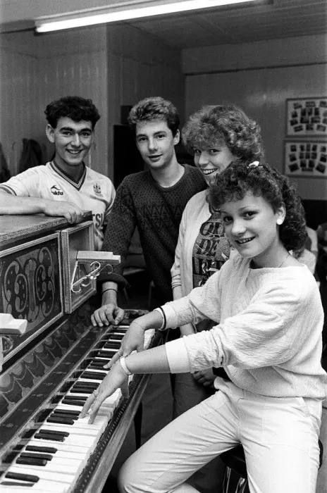 Framed Print : Rehearsing for a special production are Joanne Wilkinson at the piano with (from left