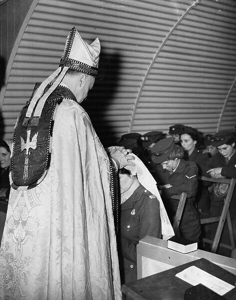 Religion Confirmation In a small nissen hut at ATS D Camp Dennington the Bishop of
