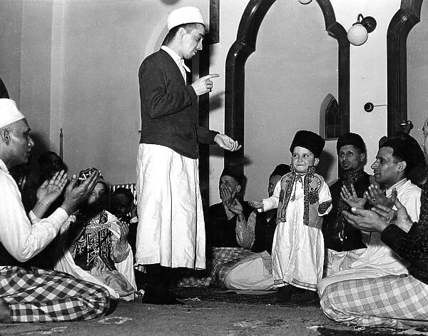 Religion Muslim A small boy is initiated into the mosque and the muslim faith