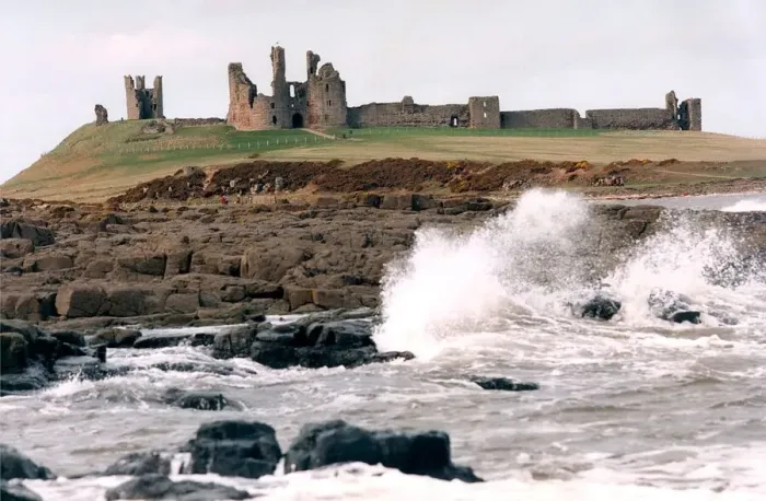 Framed Print : The remote and impressive ruins of Northumberlands Dunstanburgh Castle in July 1996