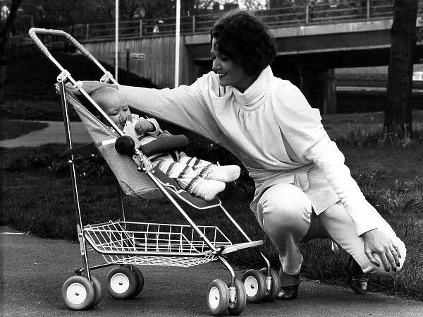 Rena pictured in a 1984-style jump suit and baby Thea relaxes in the new McLaren Dreamer