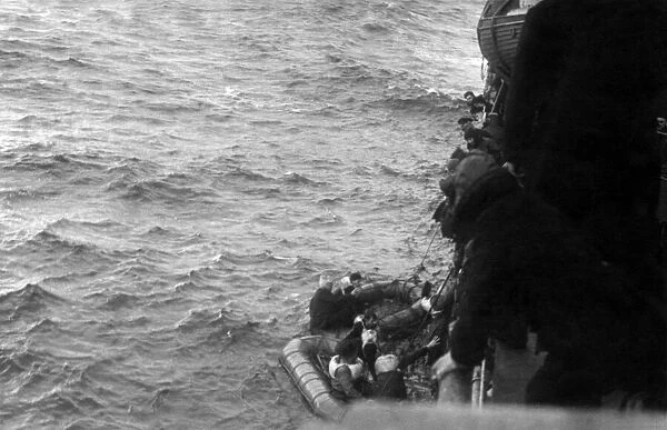 Rescue of the crew of a merchant ship which was sunk in the mid Atlantic by a Nazi
