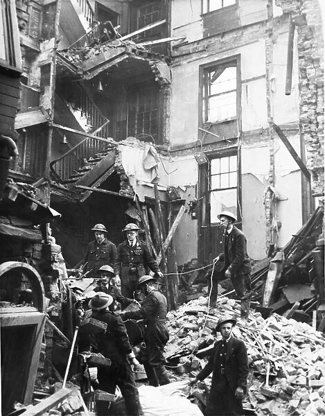 Rescue squad at work amongst the debris of a wrecked pub in South Street, Liverpool