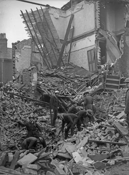 Framed Print : A rescue squad at work searching for survivors of a house which received a direct hit Framed Print : A rescue squad at work searching for survivors of a house which received a direct hit