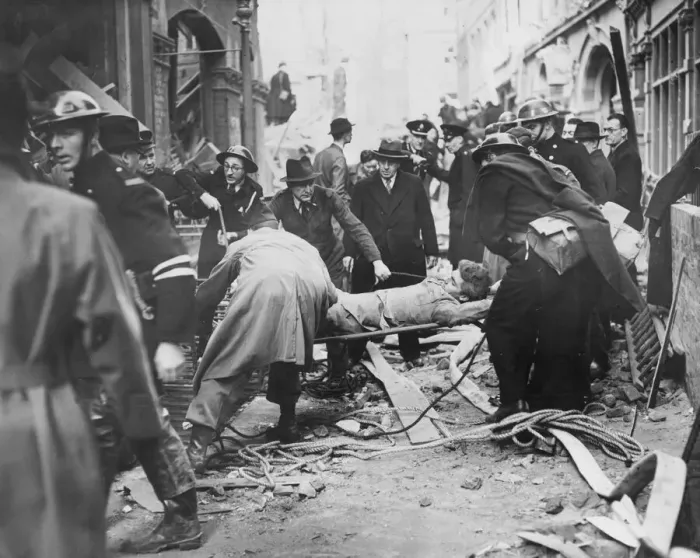 Framed Print : Rescue workers bringing up a soldier victim from an area he was blown into following a Framed Print : Rescue workers bringing up a soldier victim from an area he was blown into following a