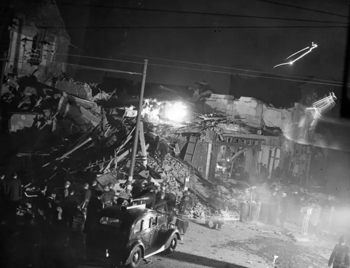Framed Print : Rescue workers engaged in a heap of debris after a bomb had struck a London dancehall Framed Print : Rescue workers engaged in a heap of debris after a bomb had struck a London dancehall