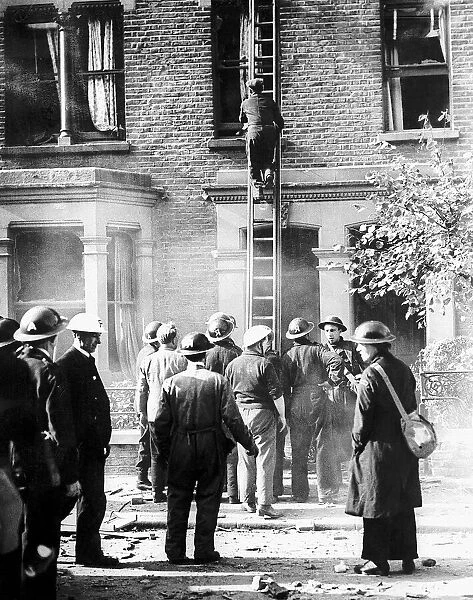 Rescue workers at scene of bomb damaged house during WW2