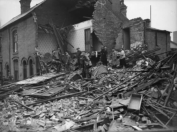 Rescue workers searching the rubble of a house in Aston, Birmingham