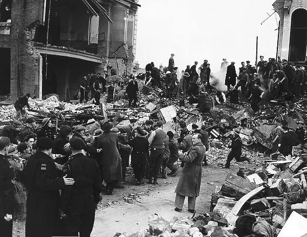 Rescuers search for survivors among the remains of school hit by a bomb during a WW2 air