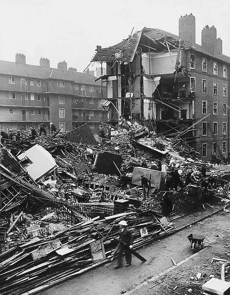 Rescues services search the remains of flats in Shoreditch London after a WW2 air raid