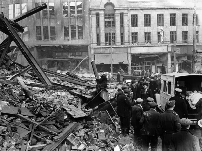 Framed Print : Rescuing wounded at Fitzalan Square, Sheffield. Ambulance taking one of the rescuers who