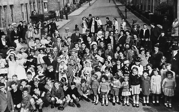 Residents of Beche Road, Cambridge pose during street party celebrations