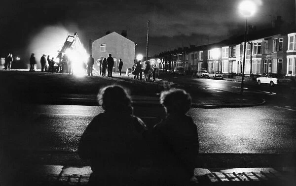 Residents of Hornby Boulevard, Bootle gather to watch a private bonfire