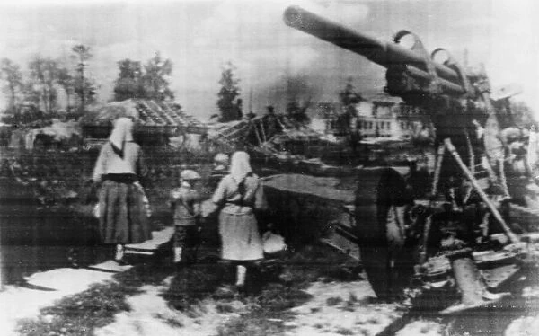 Residents return to their homes in a Soviet village on the way to Bryansk
