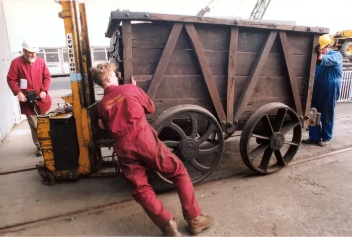 Framed Print : Restoration engineer Grodon Stark, on the flat bed is helping to move an anciet wagon