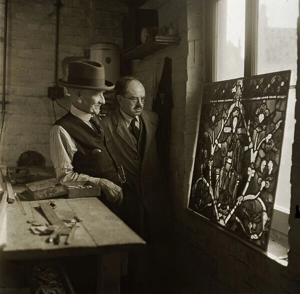 Restoring the blitzed stained glass window of Canterbury Cathedral is Mr Caldwell aged 92