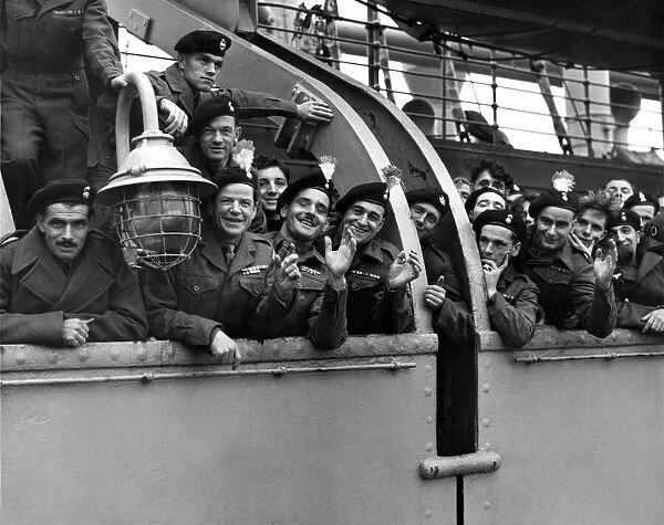 Returning from Korea Some of the troops lining the rails of the ship in mid-river