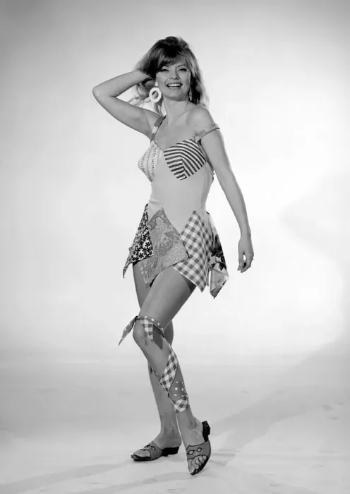 Framed Print : Reveille Beachwear Fashion Feature Woman modelling a patchwork one piece swimming