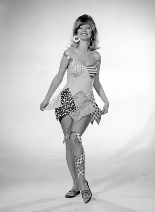 Framed Print : Reveille Beachwear Fashion Feature Woman modelling a patchwork one piece swimming Framed Print : Reveille Beachwear Fashion Feature Woman modelling a patchwork one piece swimming