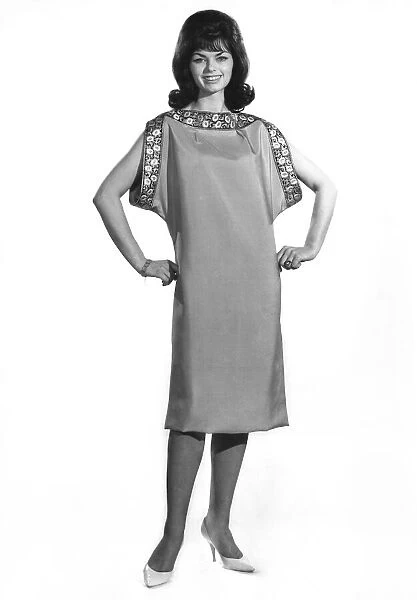 Reveille fashions 1961: Alex Mayins. modelling a simply summer dress with detailling