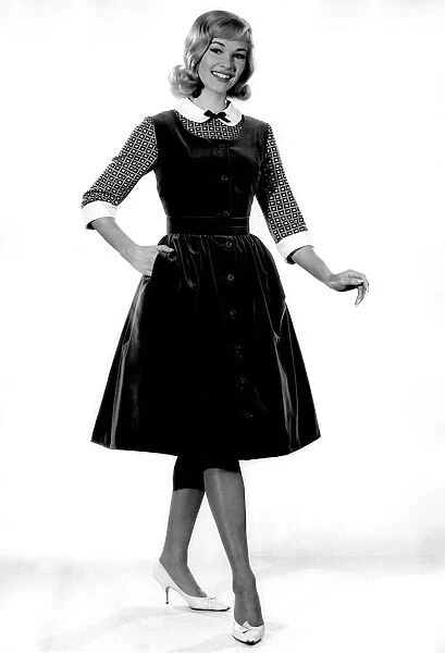 Reveille fashions 1962: Jo Waring modelling velvet pinafore dress. February 1962 P008886