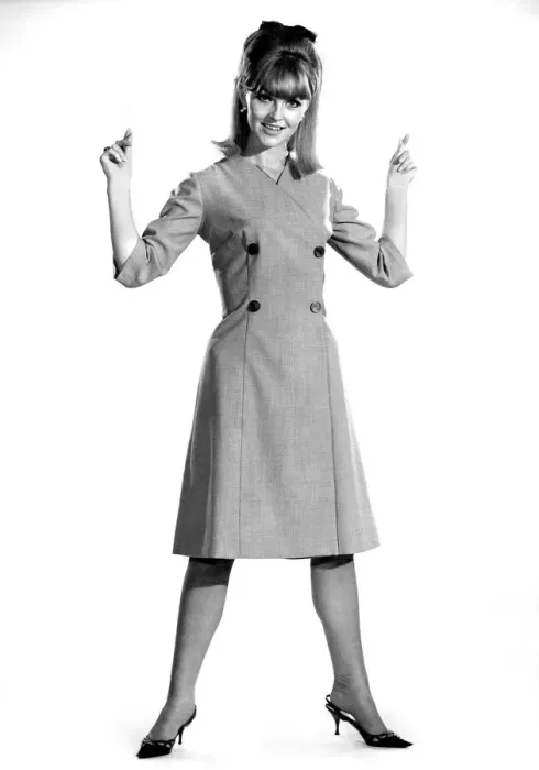 Framed Print : Reveille Fashions 1964: Ann Roberts modeling a double breasted coat September 1964 Framed Print : Reveille Fashions 1964: Ann Roberts modeling a double breasted coat September 1964