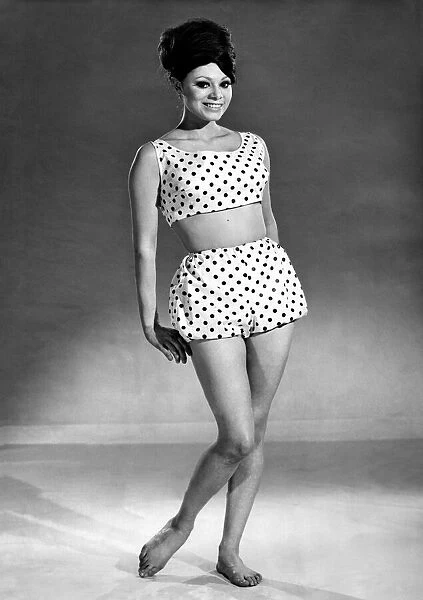 Reveille Fashions 1964: Carmen Dene modeling a two piece beach outfit. June 1964 P007574